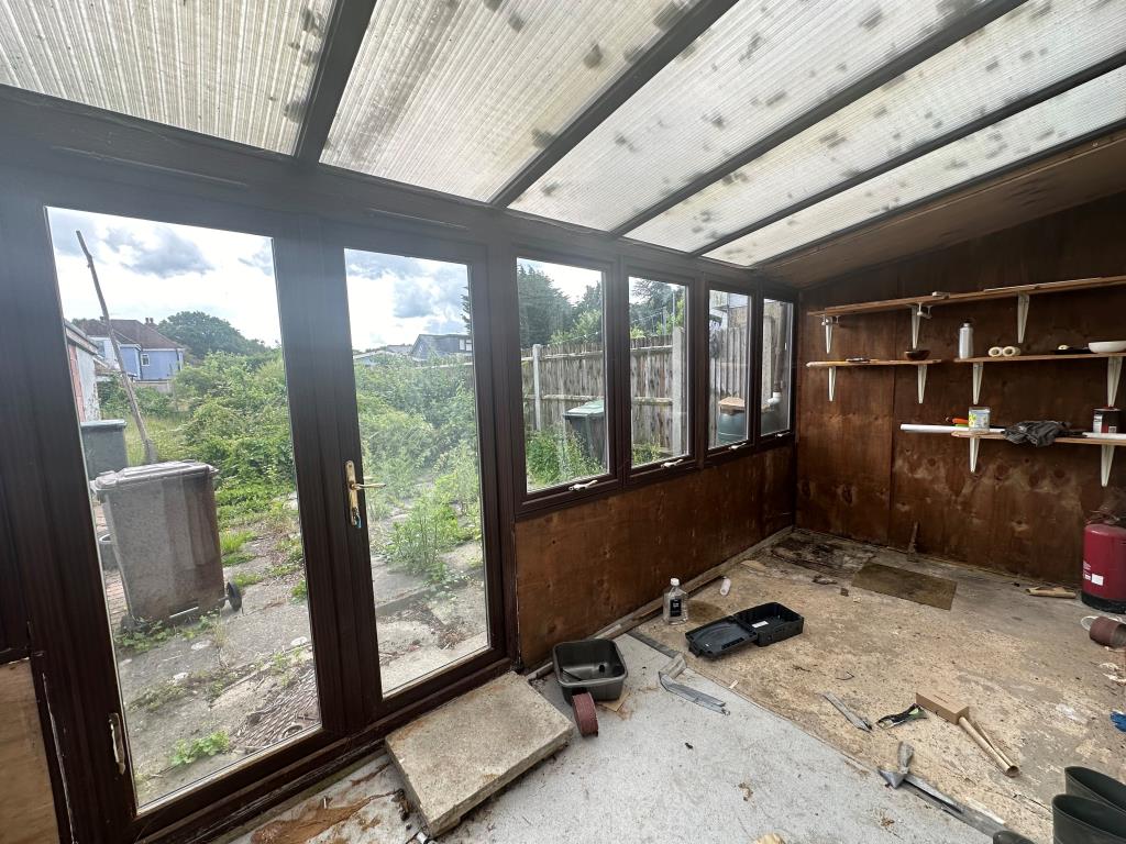 Lot: 157 - CHALET BUNGALOW FOR REFURBISHMENT POTENTIAL FOR EXTENSION - Conservatory with access to garden